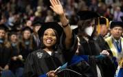 Students wave to friends and family