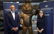 Dr. Marisela Rosas Hemphill and President Brian O. Hemphill, Ph.D. standing with Big Blue statue.